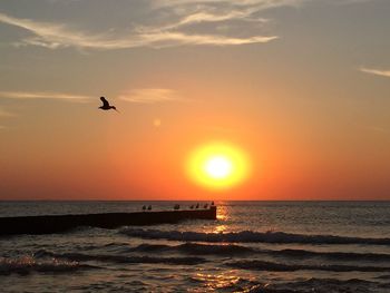 Scenic view of sea at sunset