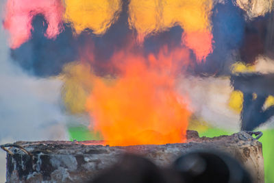 Close-up of fire against orange sky