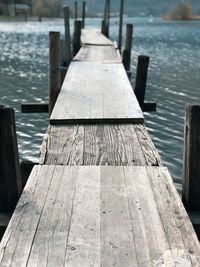 Wooden jetty leading to pier over sea