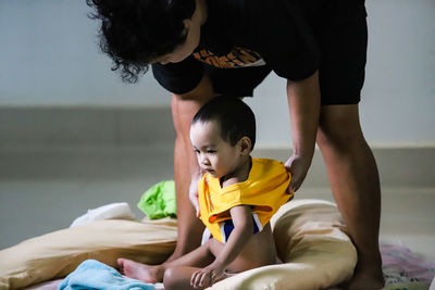 Rear view of mother and son