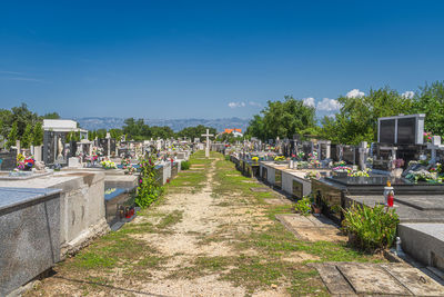 View of cemetery against blue sky