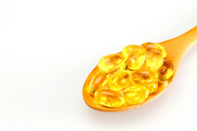 Close-up of yellow cake on white background