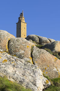 Tower of hercules against clear blue sky