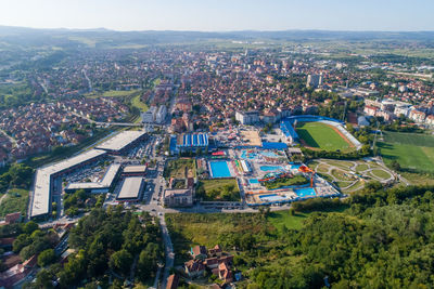 High angle view of city buildings against sky