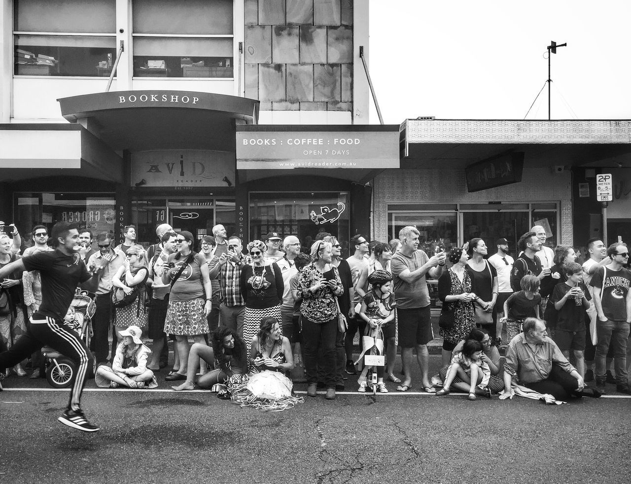 large group of people, real people, men, built structure, women, text, architecture, day, building exterior, outdoors, crowd, casual clothing, music, street, lifestyles, leisure activity, arts culture and entertainment, protestor, musician, performance, full length, city, adult, people, adults only