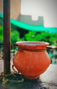 Close-up of old red metal in yard