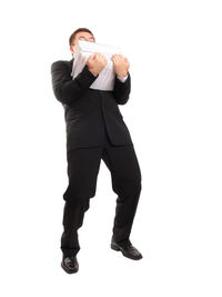 Low angle view of man wearing mask against white background