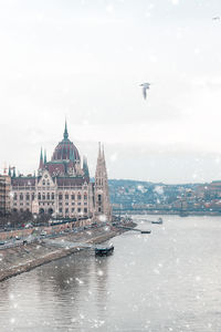 View of buildings in city against sky
