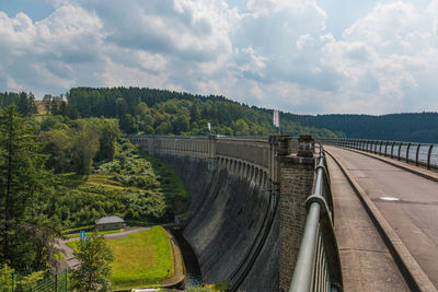 View of dam on bridge against sky