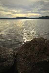 Scenic view of sea against sky at sunset