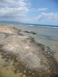 Scenic view of beach against sky