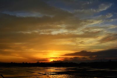 Scenic view of sea against romantic sky at sunset