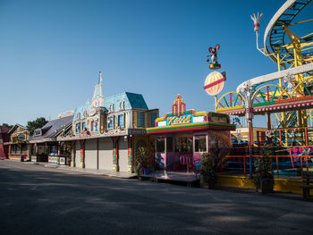 Amusement park against clear sky