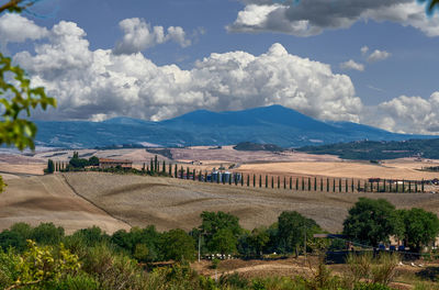 Scenic view of landscape and mountains against sky