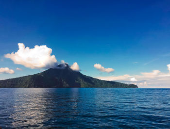 Scenic view of sea against blue sky