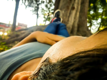 Low section of man relaxing outdoors