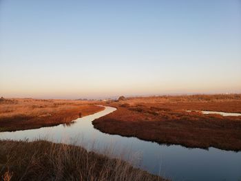 Scenic view of land against clear sky