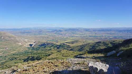 High angle view of landscape against clear blue sky