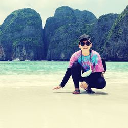 Portrait of man sitting on beach