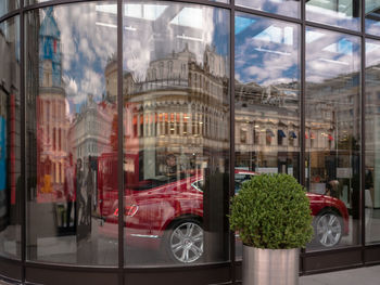 Reflection of cars on glass window