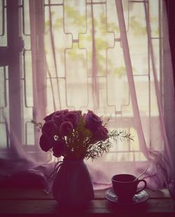 Flower vase on window sill