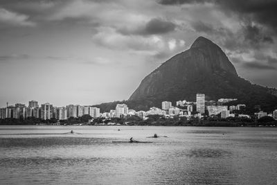 Scenic view of sea and buildings against sky