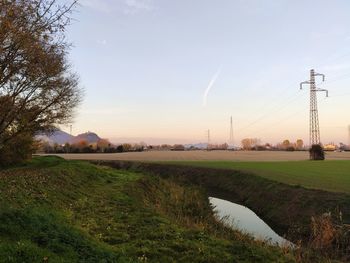 Scenic view of field against sky during sunset