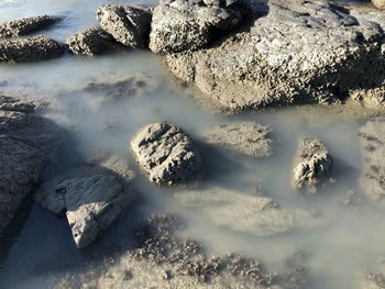 High angle view of rocks in sea