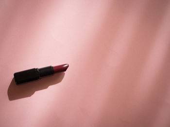 High angle view of pen on table against wall