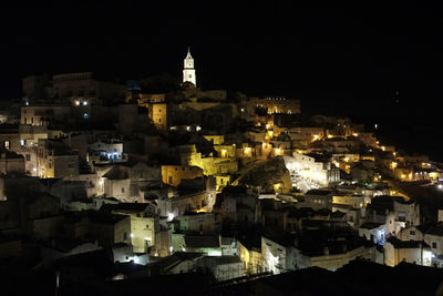 Illuminated buildings in city at night