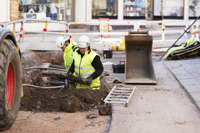 Workers in reflective clothing during work