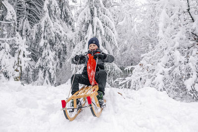 Woman on snow covered land