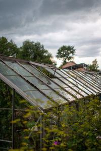 Low angle view of house roof against sky