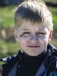 Close-up portrait of boy making a face