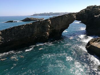 Scenic view of sea against clear blue sky