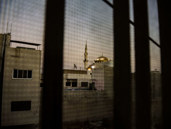 View of building seen through window