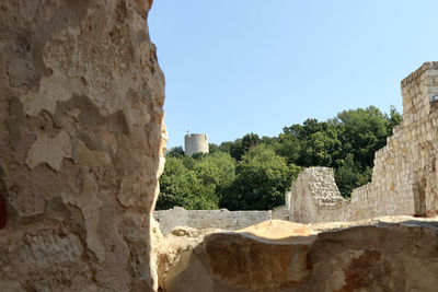 Low angle view of fort against clear blue sky