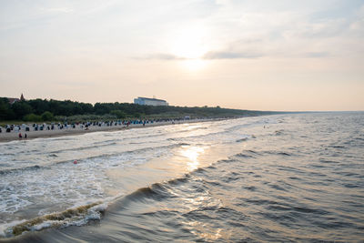 Scenic view of beach against sky during sunset