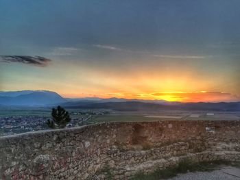 Scenic view of landscape against sky during sunset