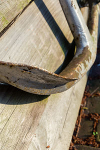 Close-up of rusty metal on wood