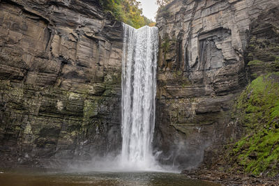 Arch bridge over waterfall