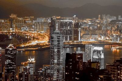 Illuminated modern buildings in city at night