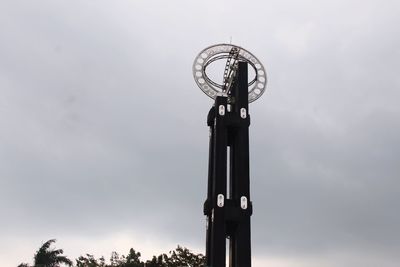 Low angle view of clock tower against sky