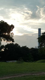 Scenic view of field against sky at sunset