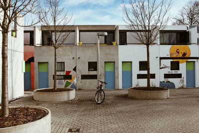 Bicycle outside house against building