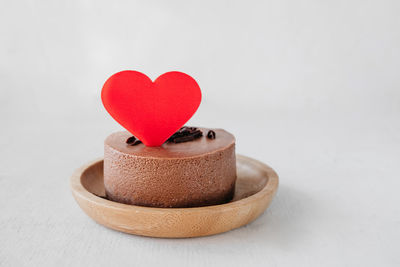 Close-up of heart shape over white background