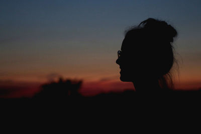 Portrait of silhouette woman against sky during sunset