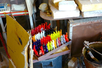 High angle view of multi colored for sale at market stall