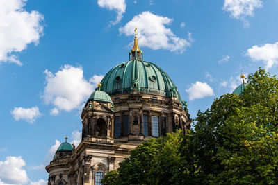 Low angle view of the dome of berlin cathedral, berliner dom, against blue sky with clouds