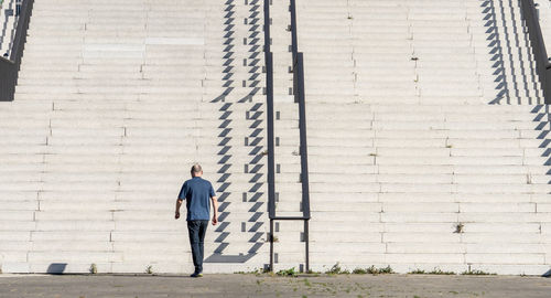 Man walking towards steps